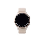 Smartwatch with a beige strap on a white background