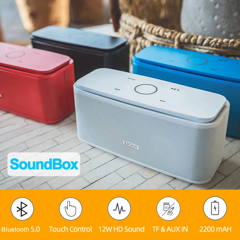 SoundBox Bluetooth speakers in various colors on a wooden floor.